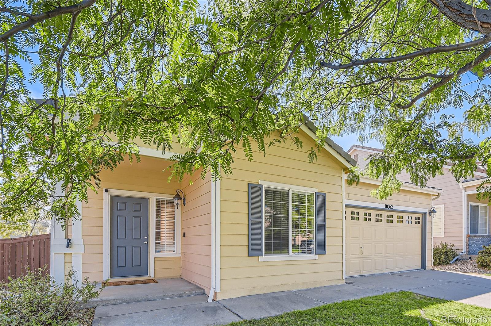 front view of a house with a yard