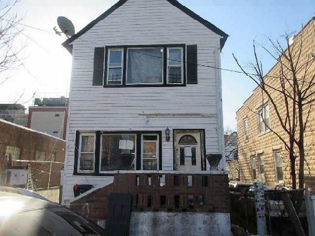 a front view of a house with yard