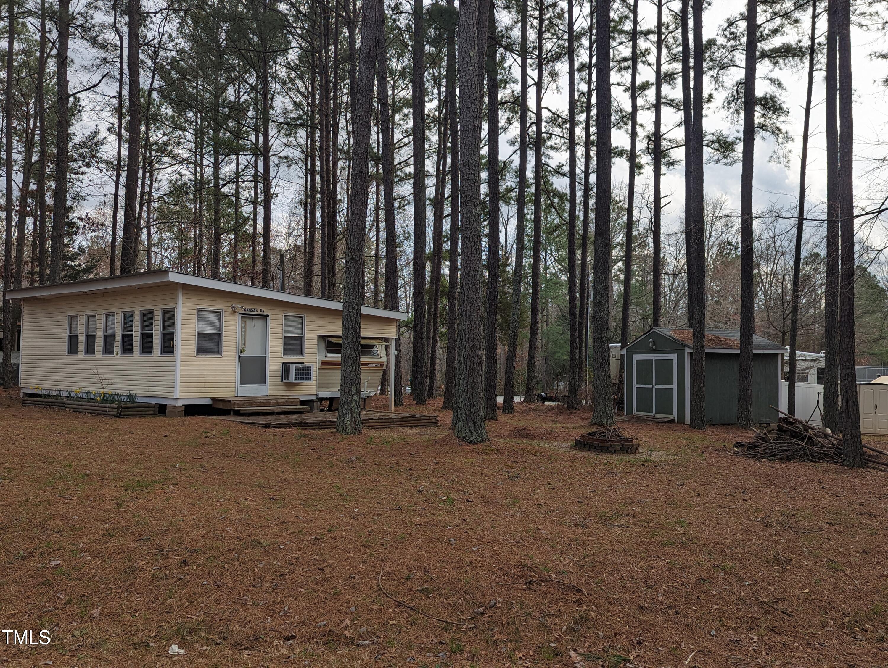 a view of a house with backyard porch and sitting area