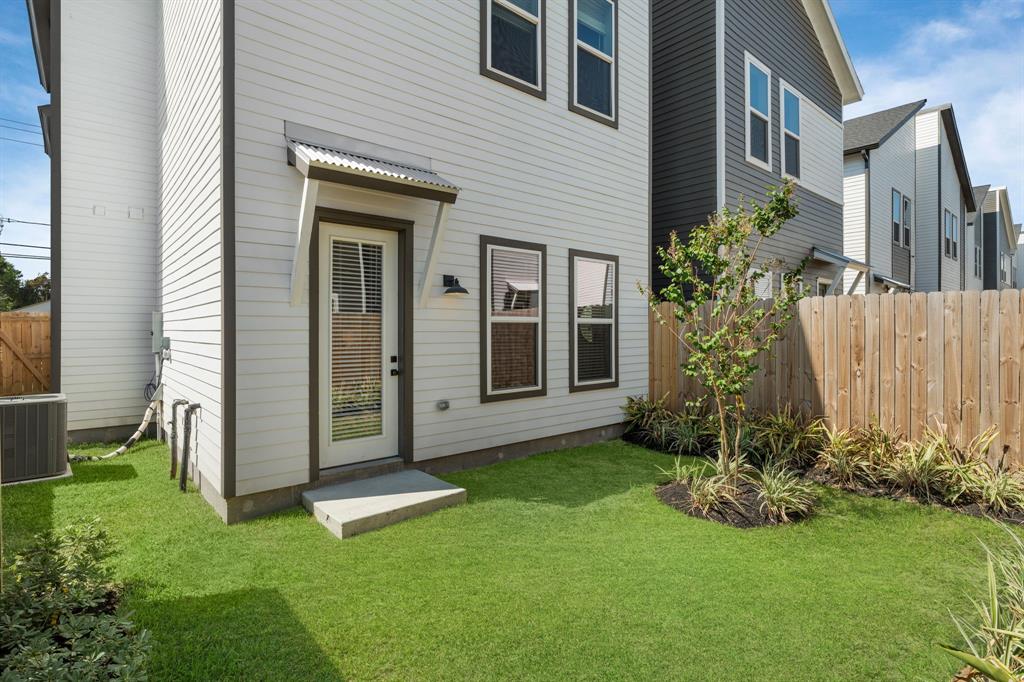 a view of a front of a house with a garden