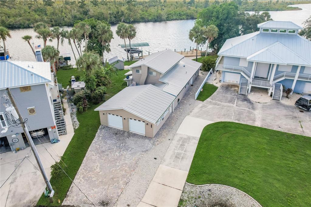 an aerial view of a house with garden space and street view