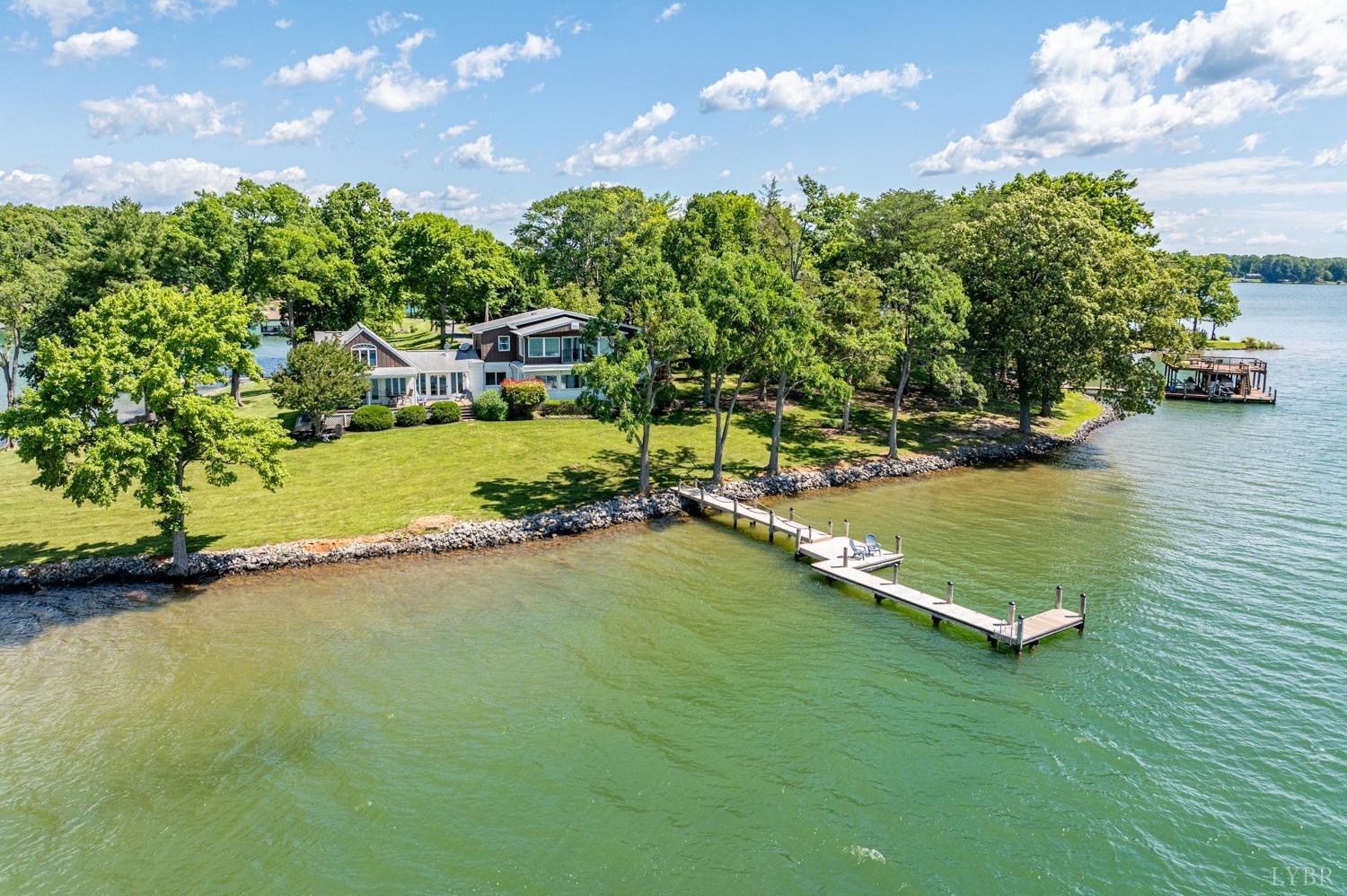 a view of a lake with a house in the background