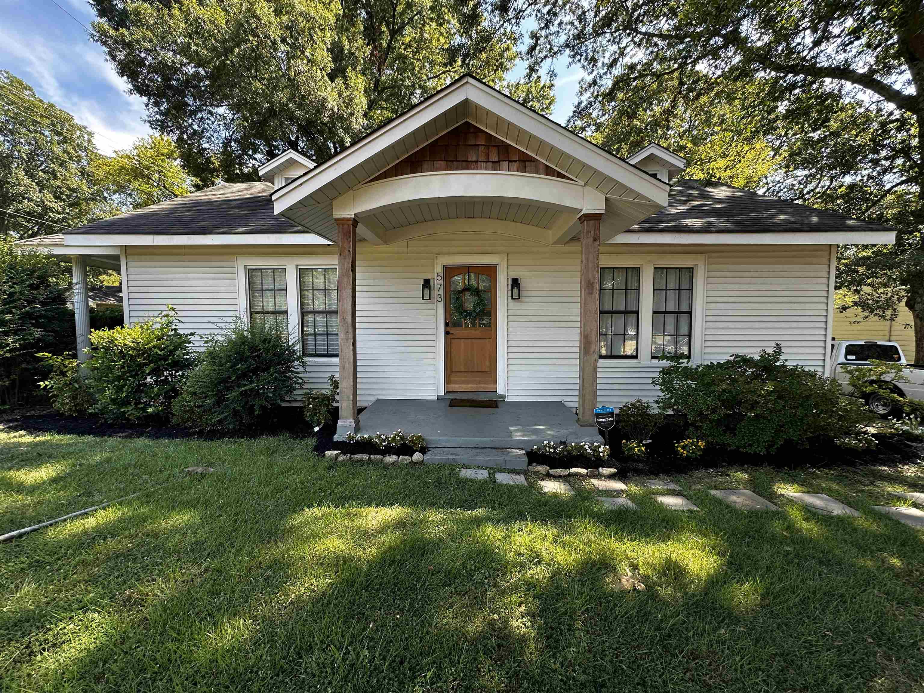 Bungalow-style house featuring a front yard