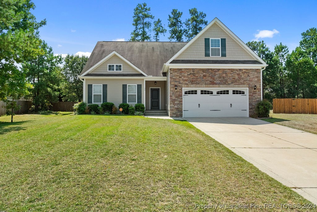 a view of house with yard and entertaining space