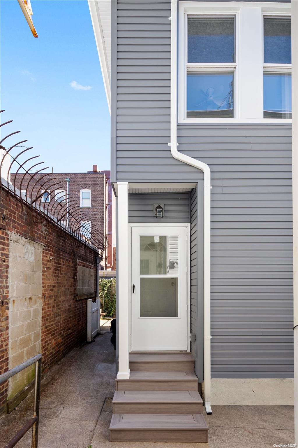 a view of a house with a door and balcony