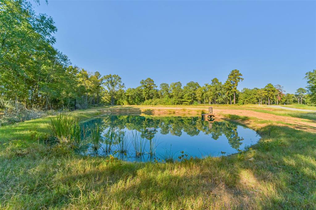 a view of a lake with a big yard