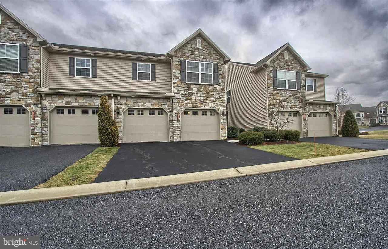 a view of a large house with a street