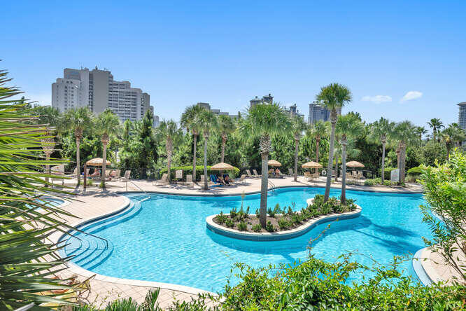 a view of a swimming pool and lounge chairs