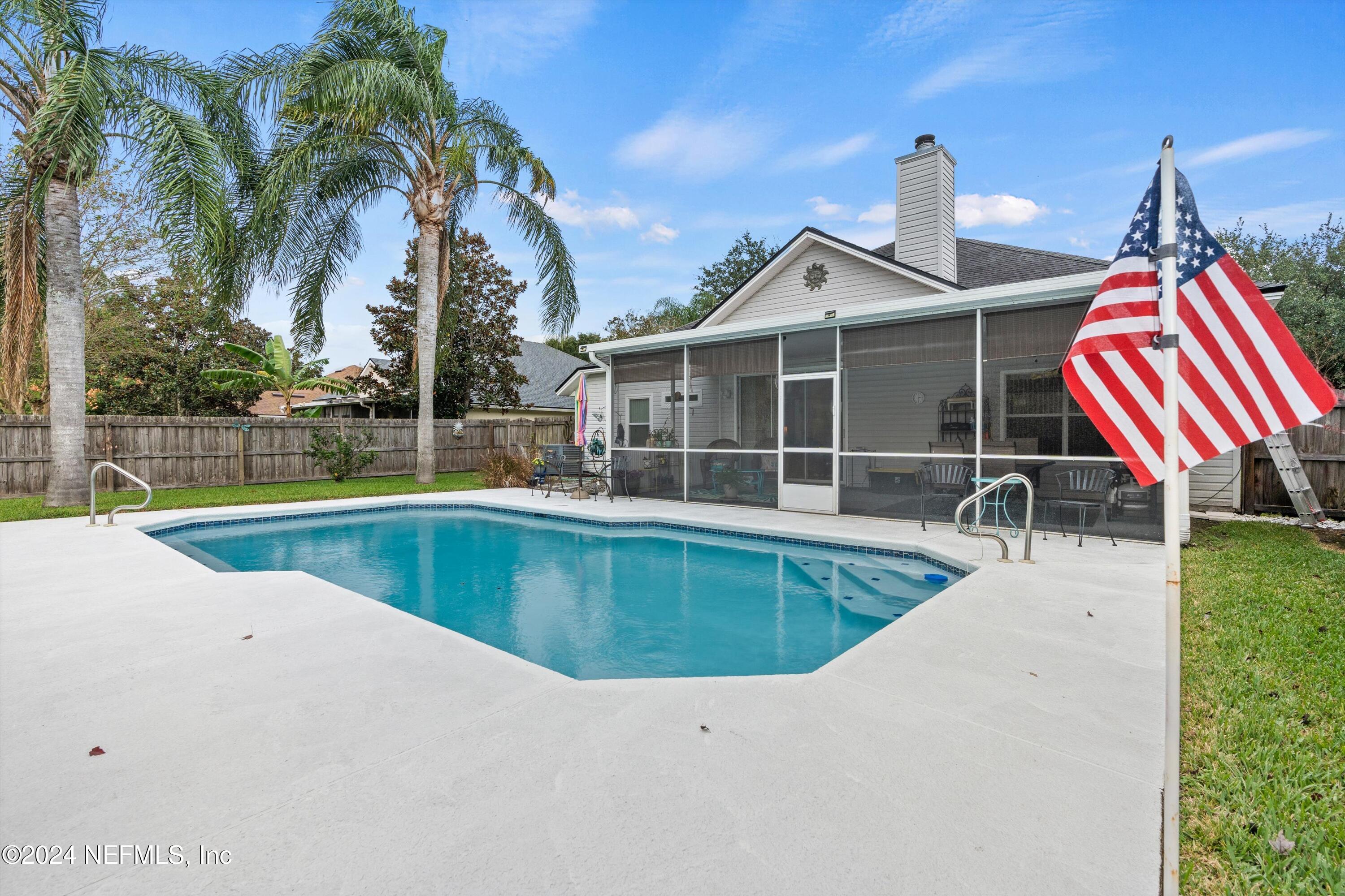 a view of a house with a swimming pool