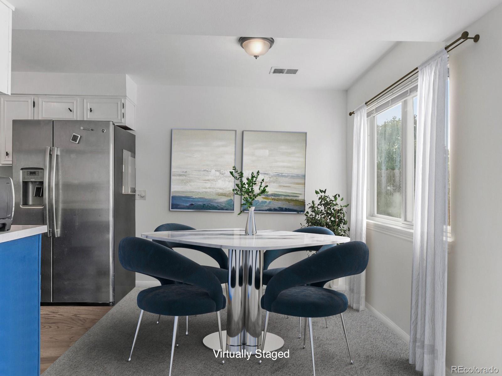 a dining room with furniture and window