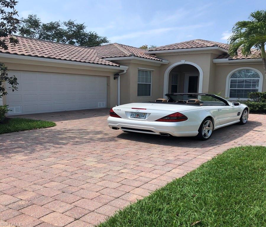 a front view of a house with parking space