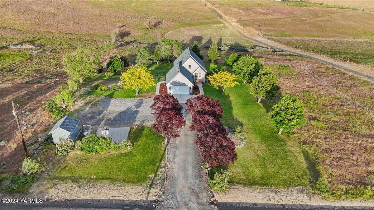 an aerial view of house with yard