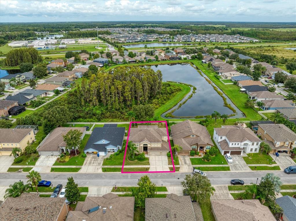 an aerial view of residential houses with outdoor space