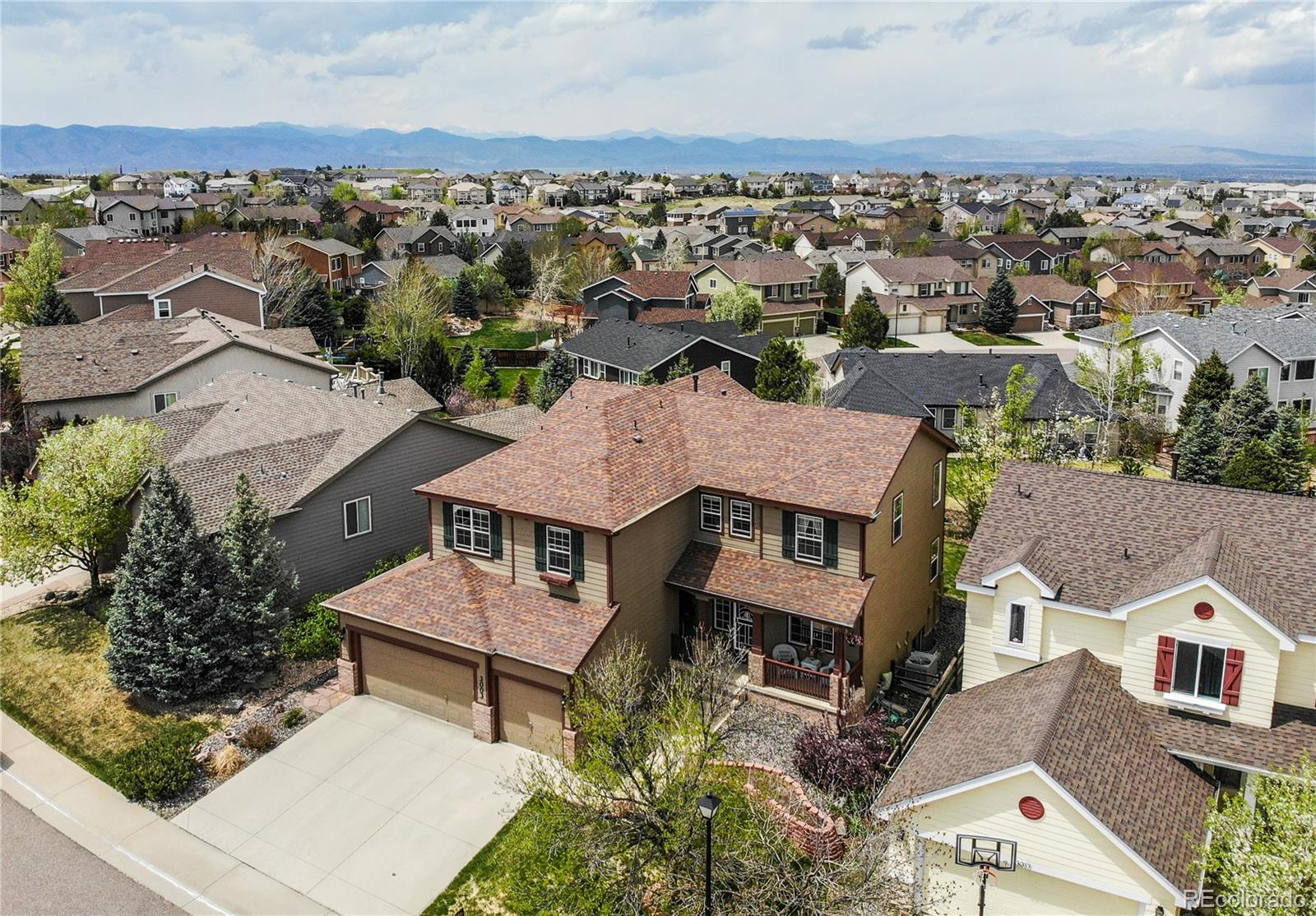 an aerial view of a house with a garden