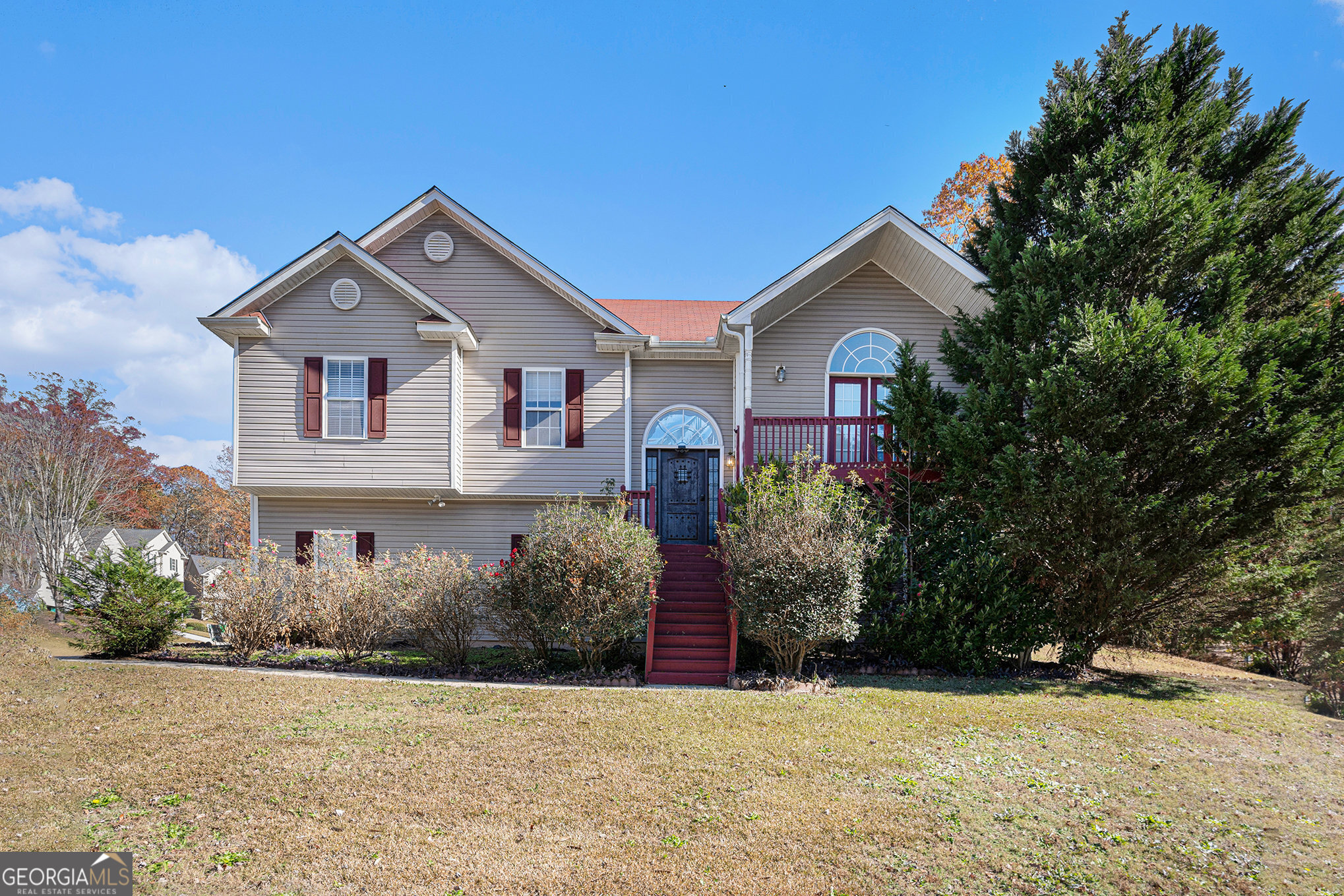 a front view of a house with a yard