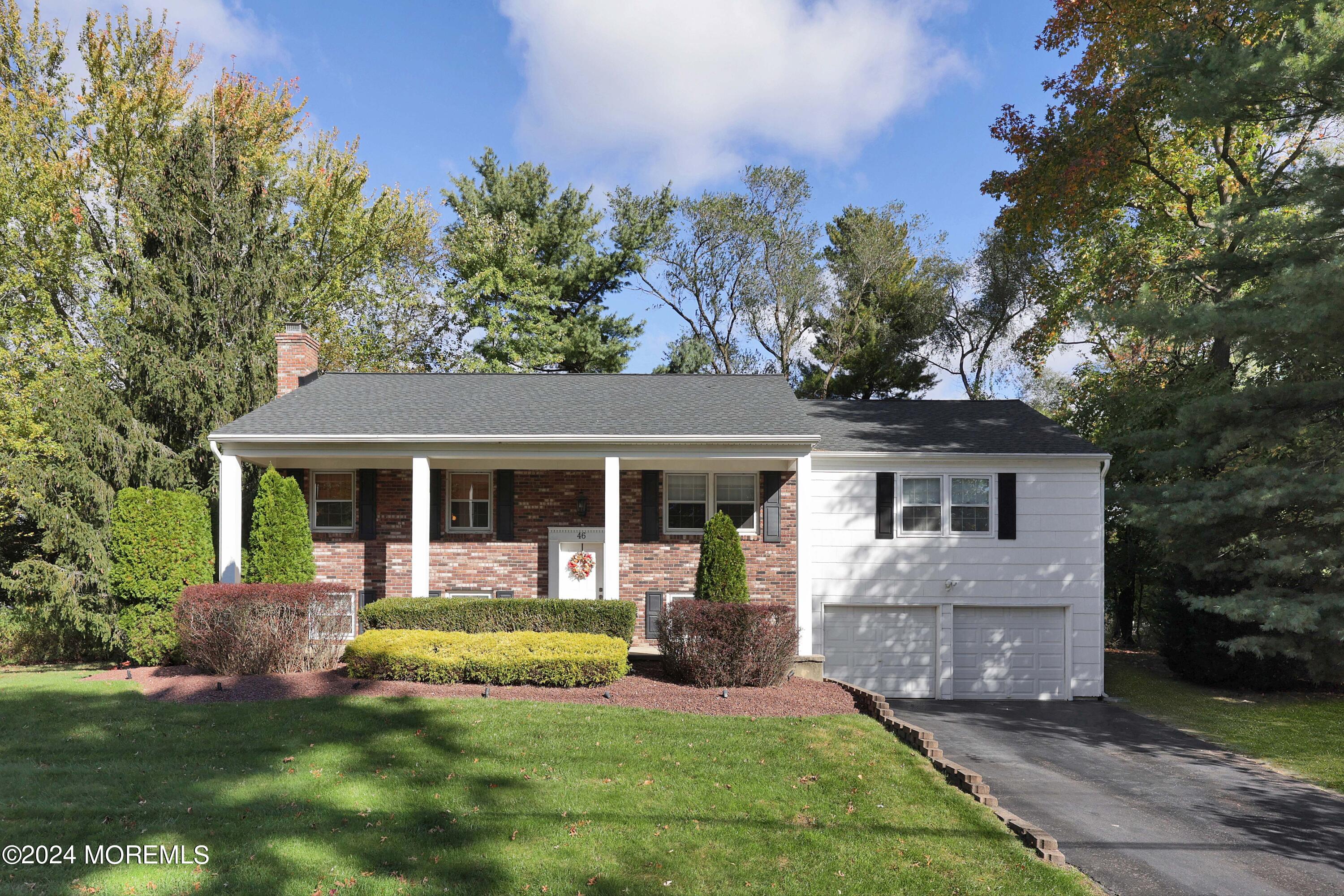 front view of a house with a yard