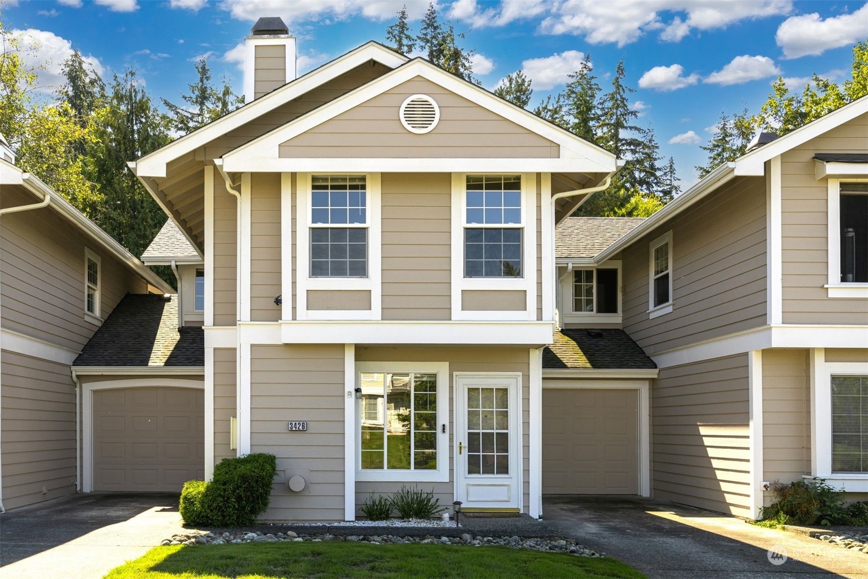 a front view of a house with a yard