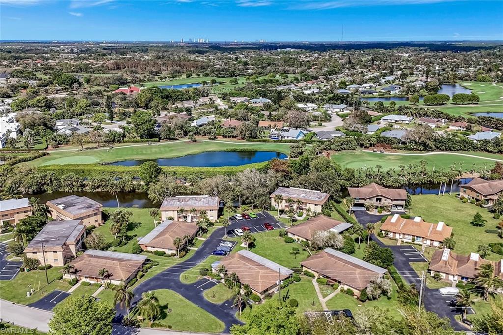 an aerial view of a houses with a yard