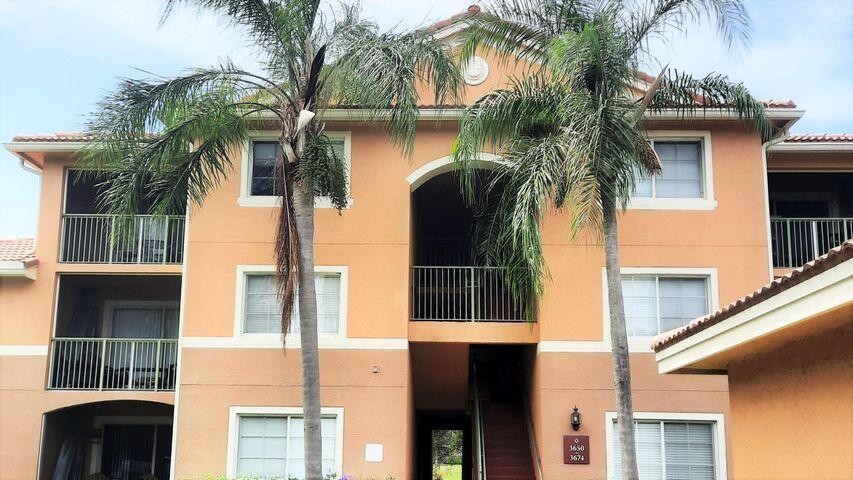 a view of a house with a palm tree