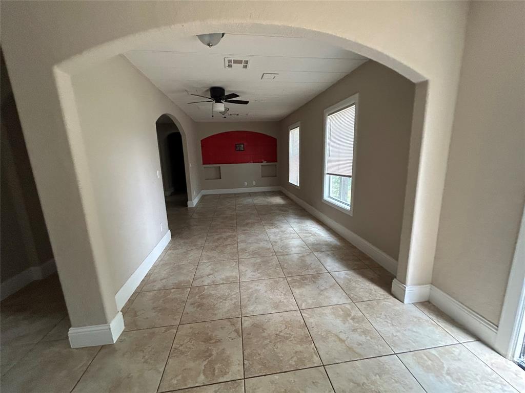 a view of a hallway with a chandelier