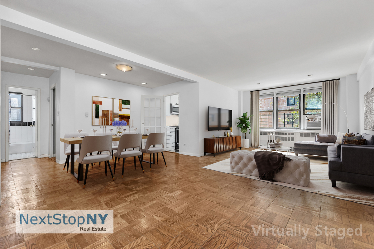 a living room with furniture a large window and a flat screen tv