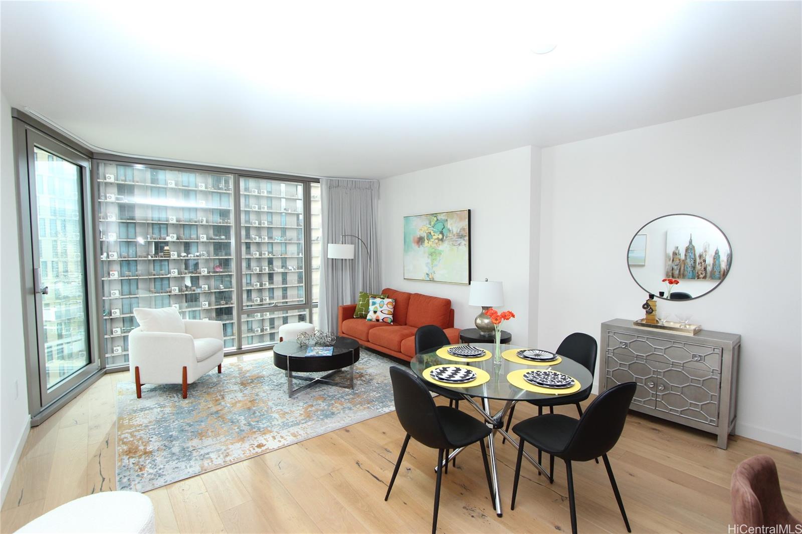 a living room with furniture and a large window