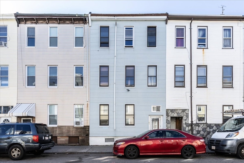 a cars parked in front of a building