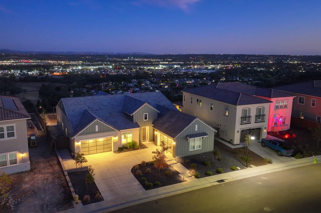 an aerial view of a house with a swimming pool