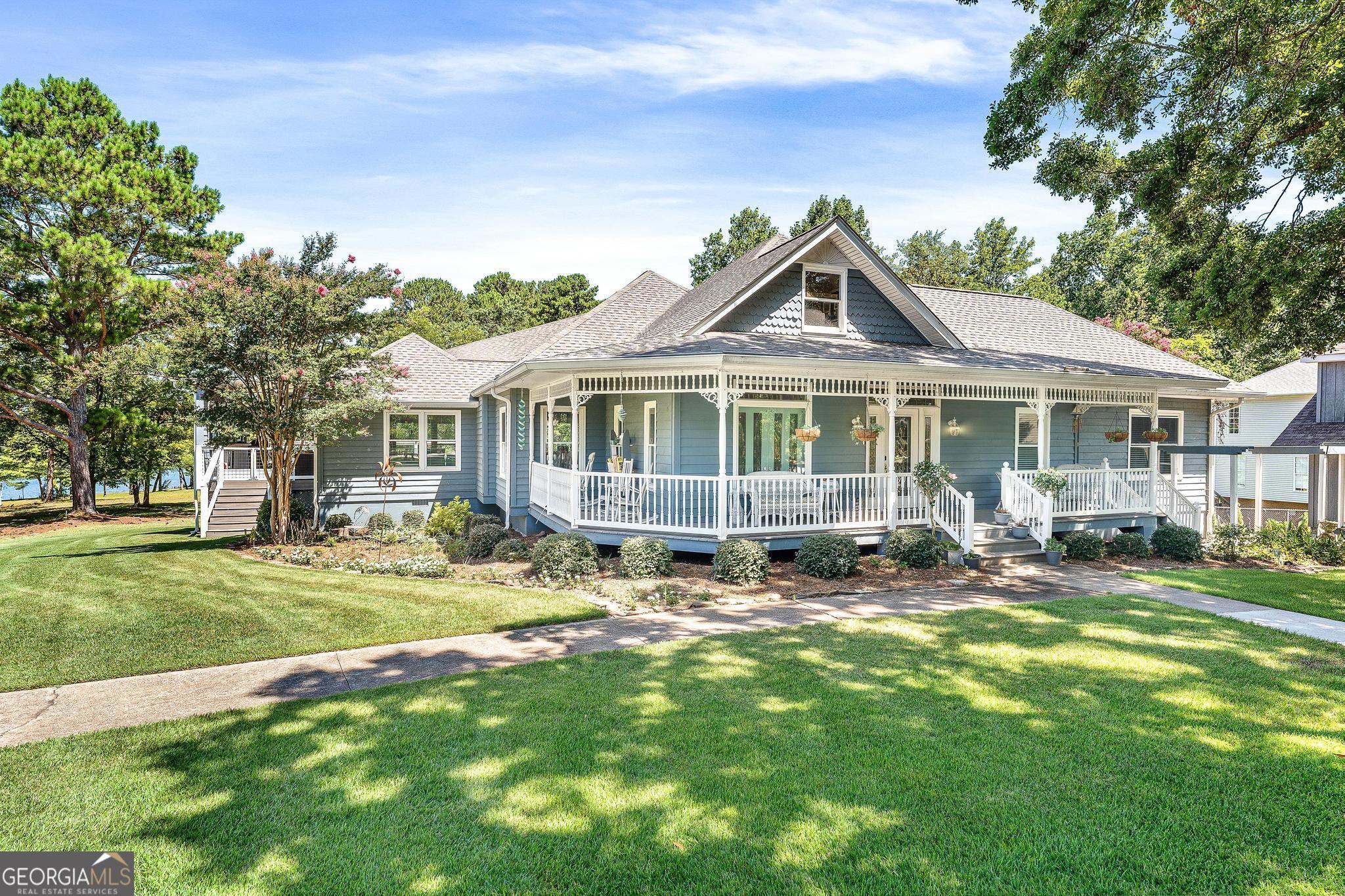 a front view of a house with a yard table and chairs