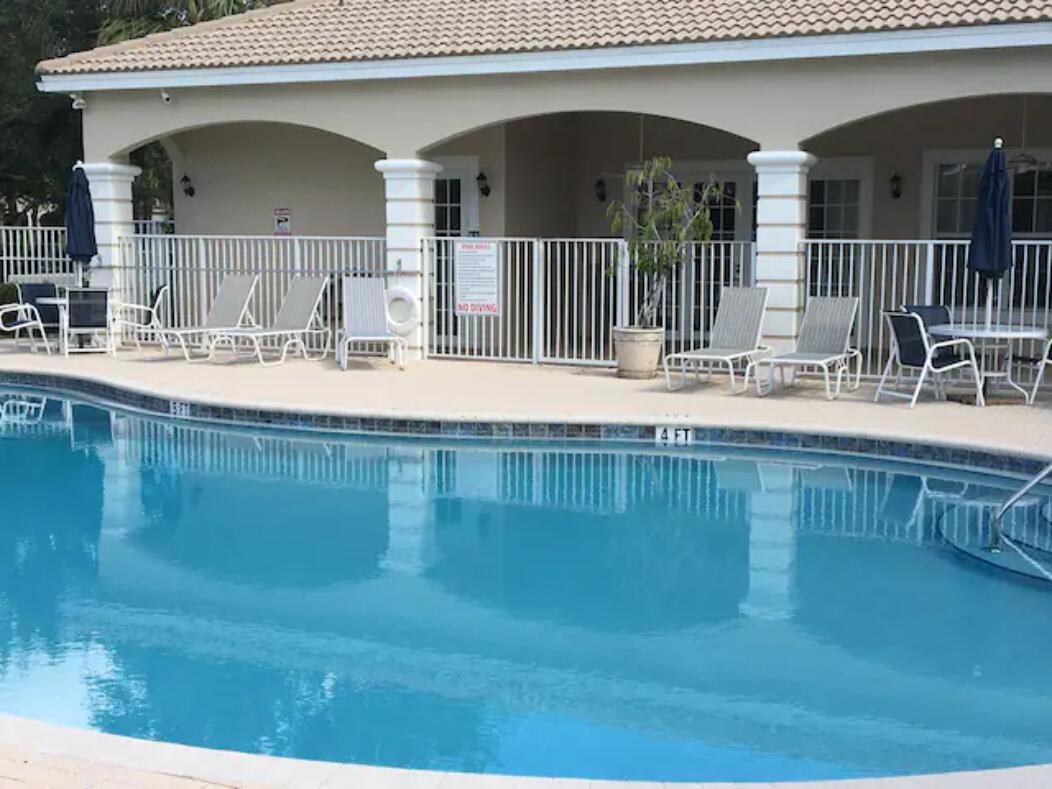 a view of a swimming pool with a patio