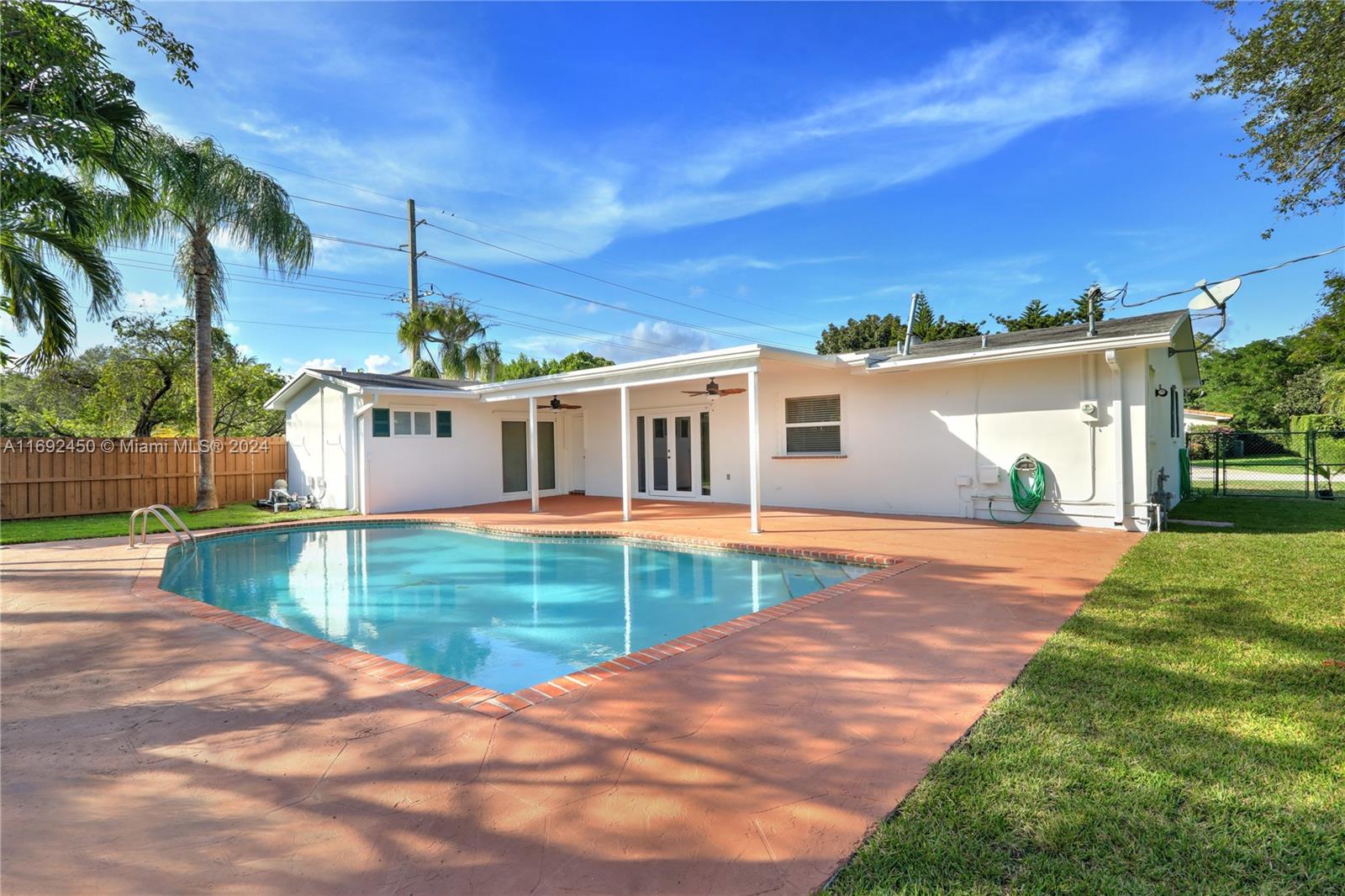 a view of a house with swimming pool