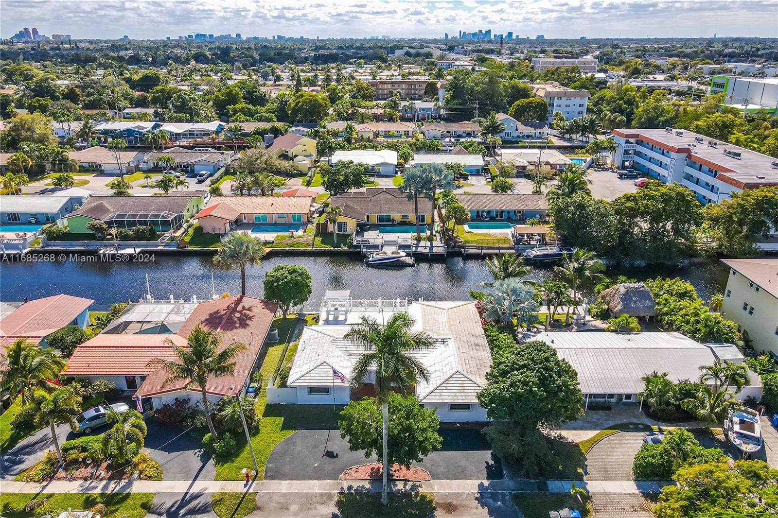 an aerial view of a house with a lake view