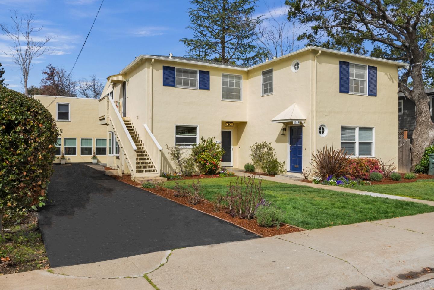 a front view of a house with a yard