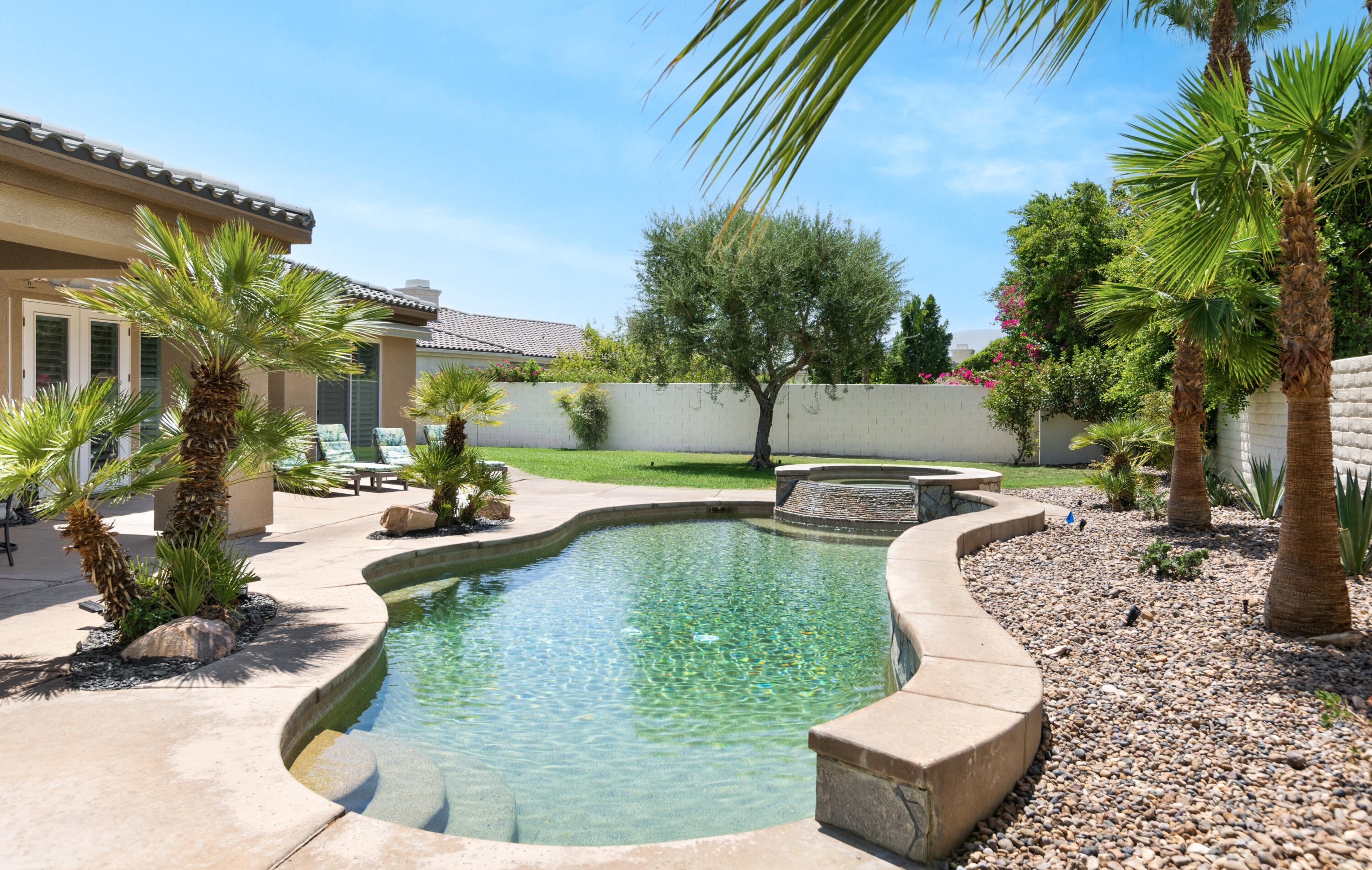 a view of a swimming pool with a patio