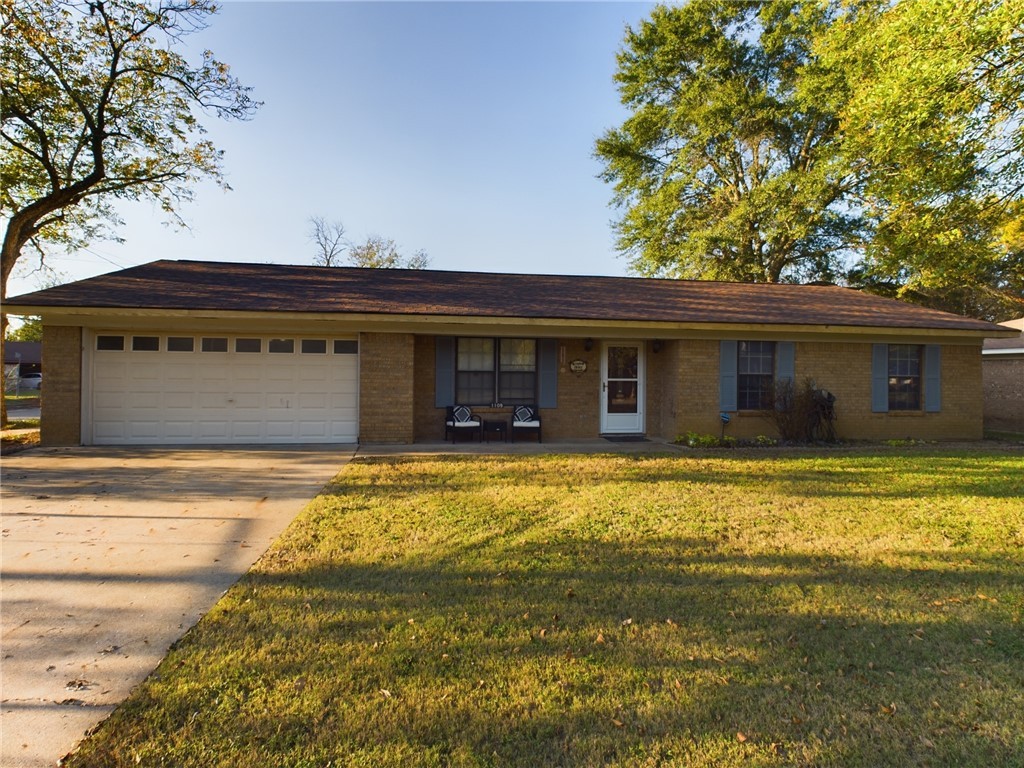 a front view of house with outdoor space