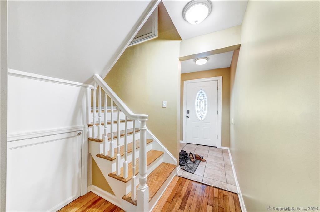 a view of entryway with wooden floor