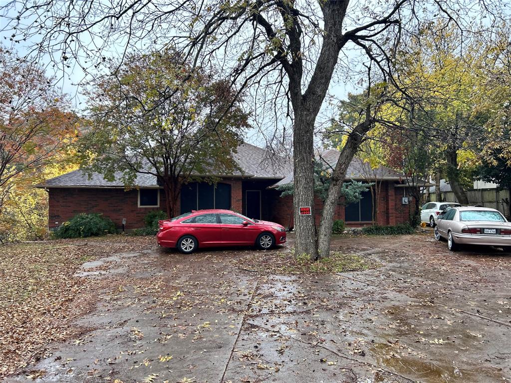 a front view of a house with parking space