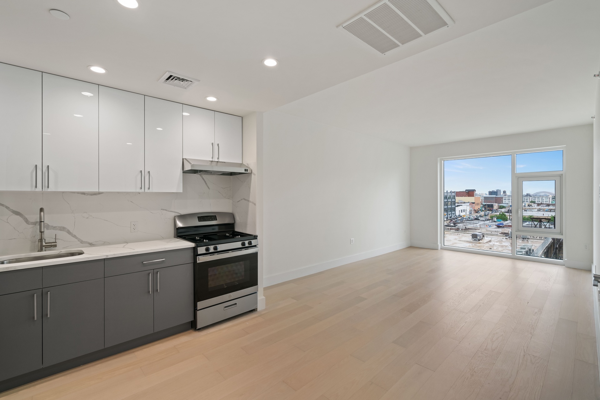 a kitchen with a sink stainless steel appliances and cabinets