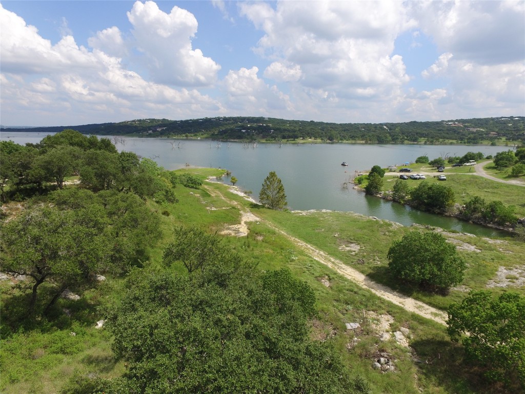 a view of a lake with houses in the back