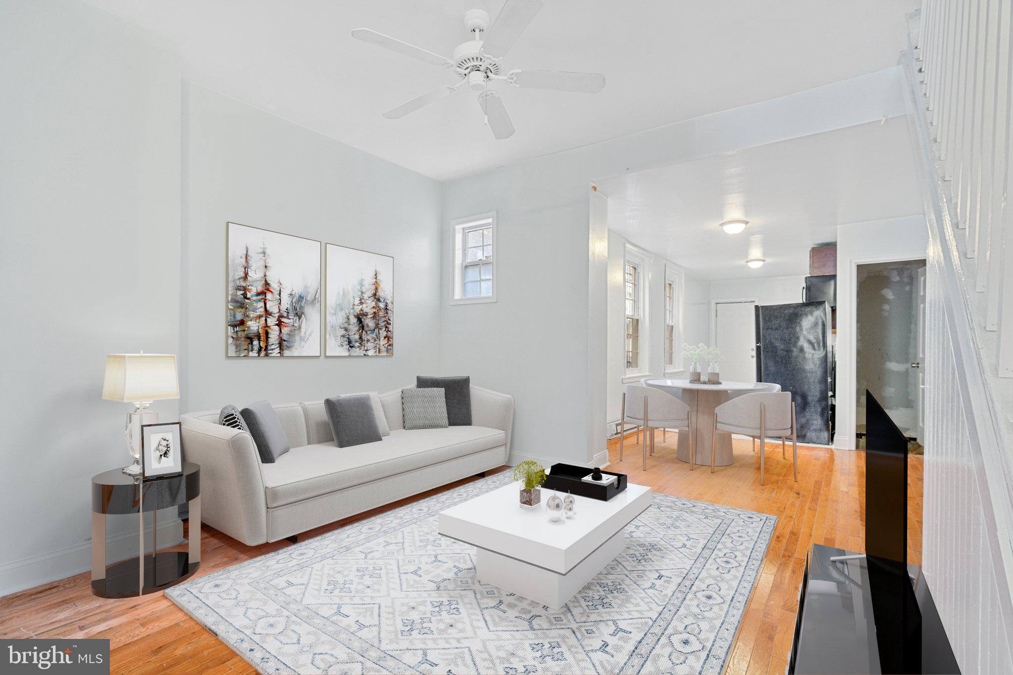 a living room with furniture and a table