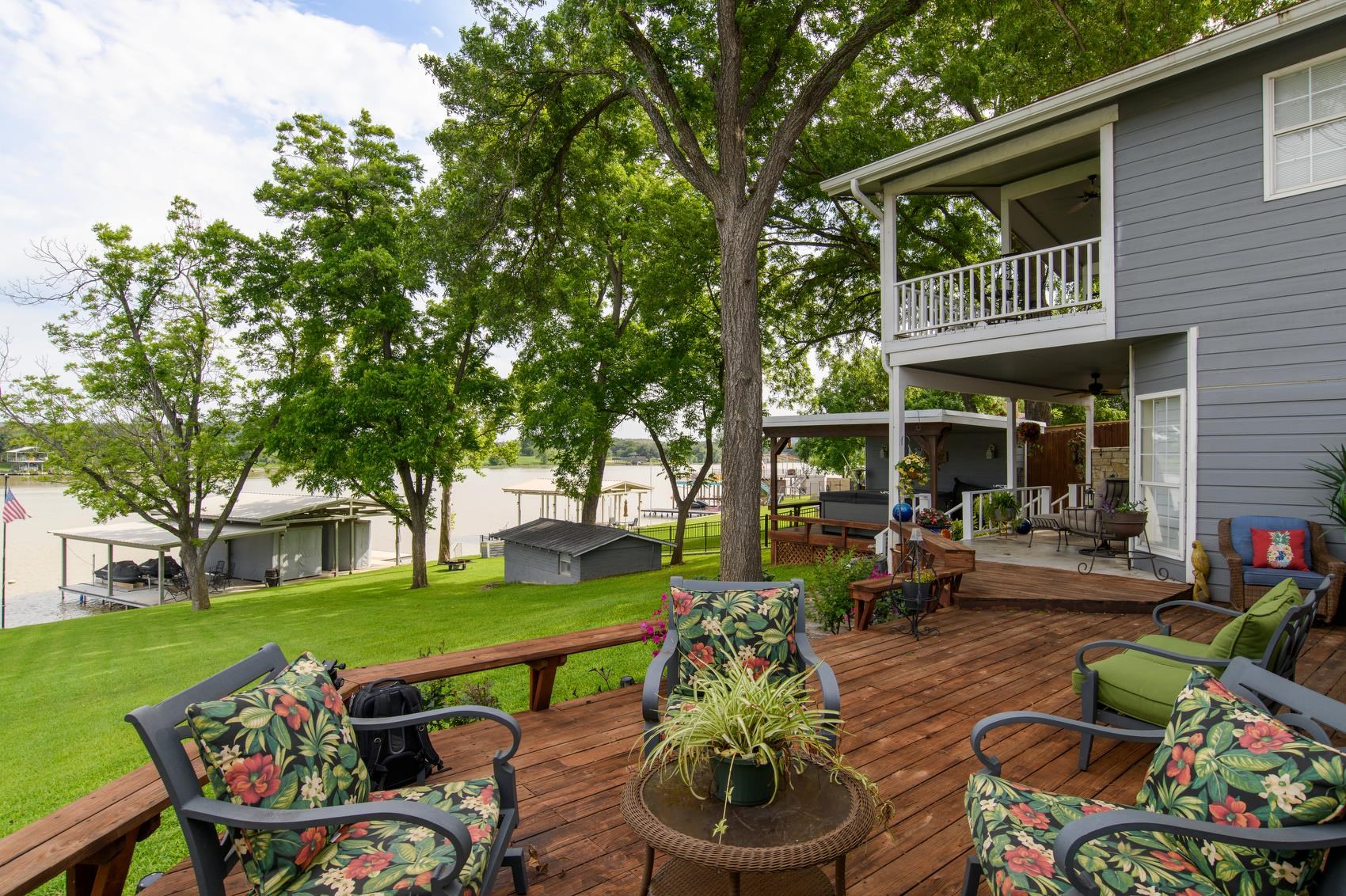 a view of an house with backyard furniture and garden