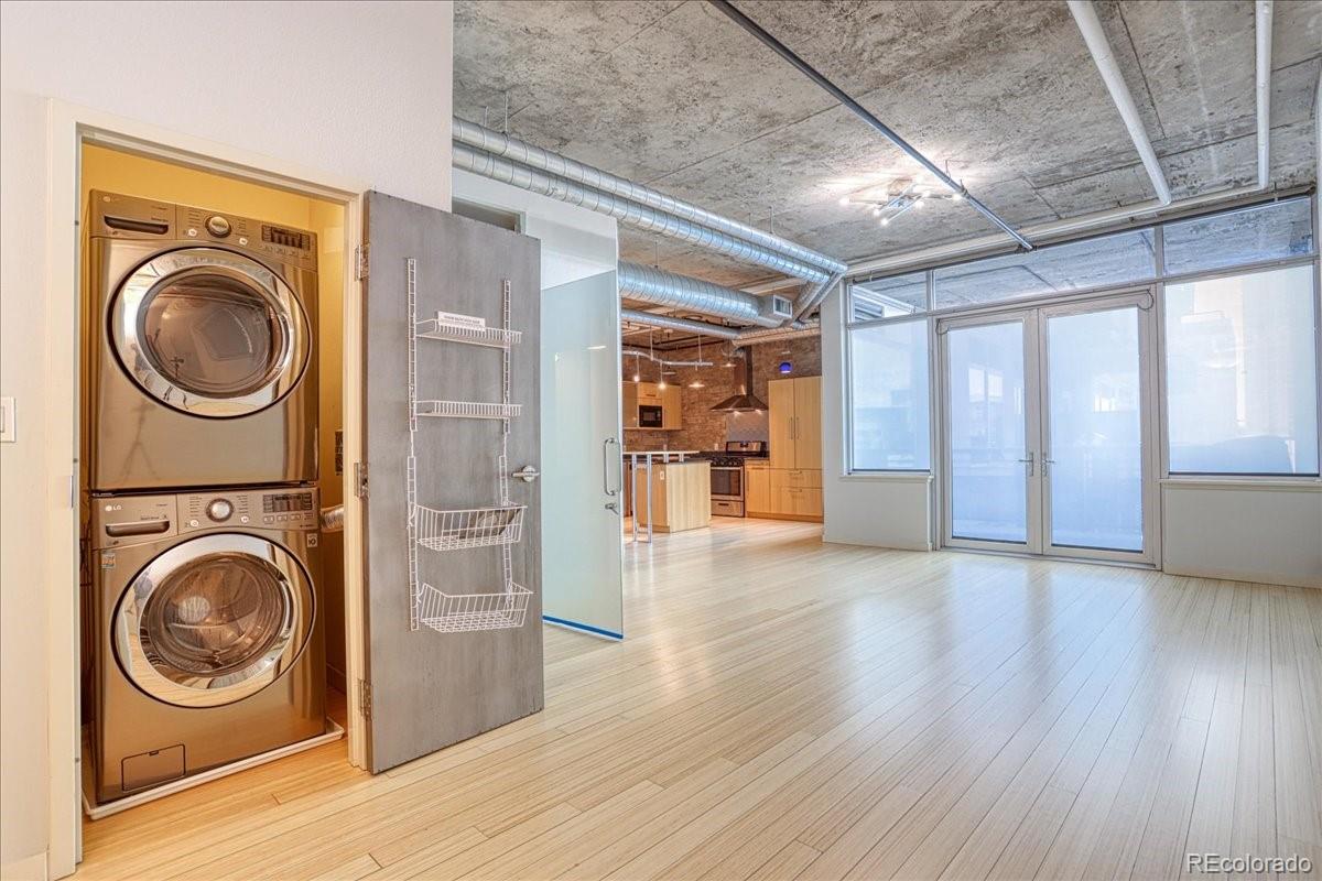 a view of a hallway with washer and dryer