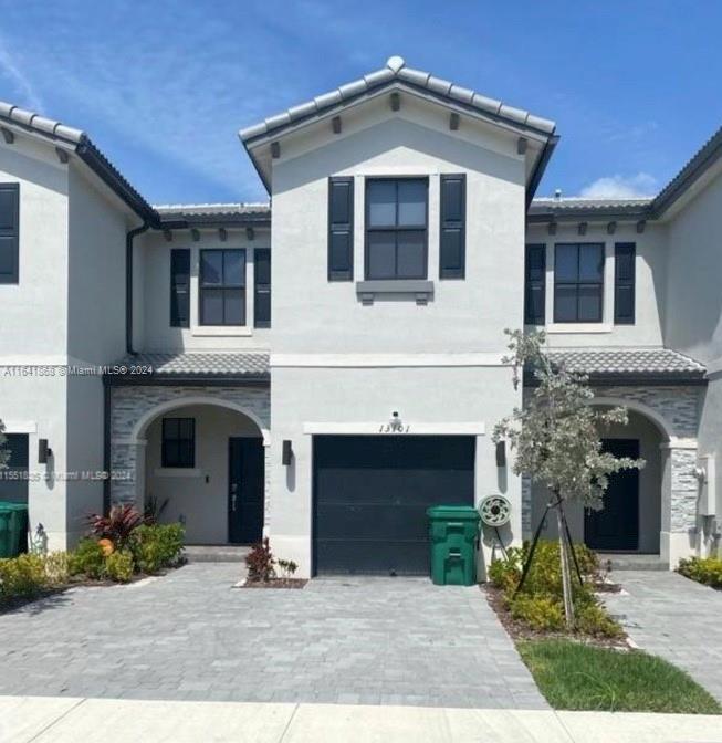 a front view of a house with yard