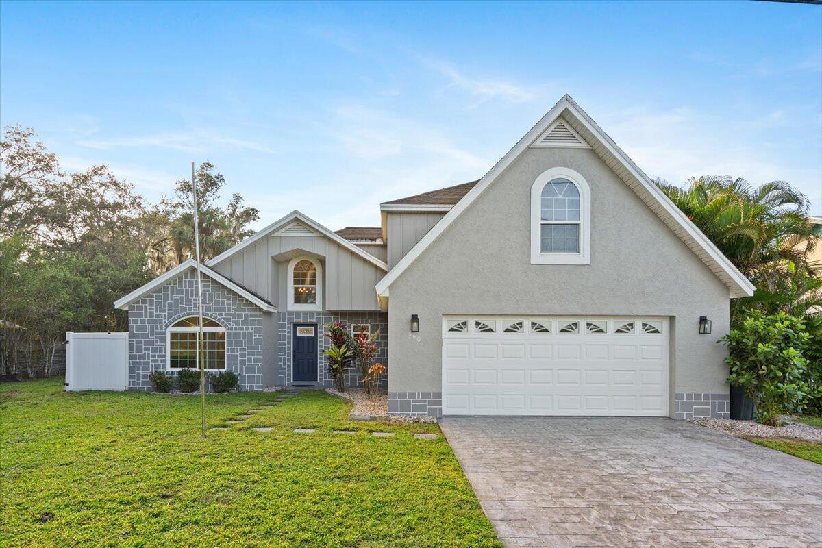 a front view of a house with a yard