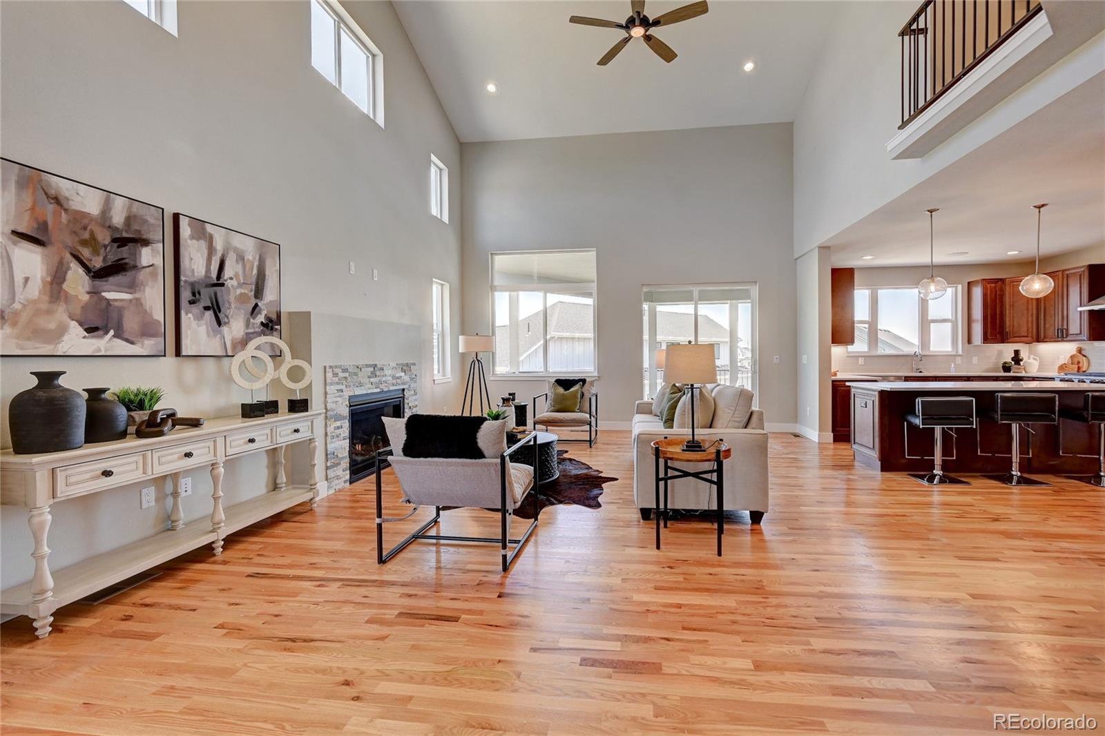 a living room with furniture and a kitchen view