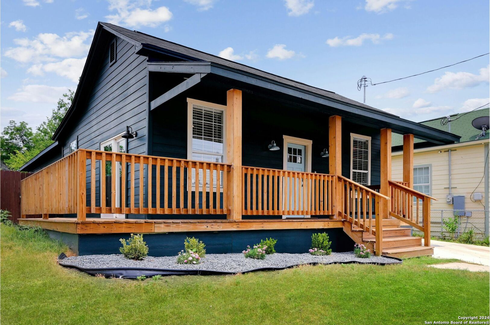 front view of a house with a yard