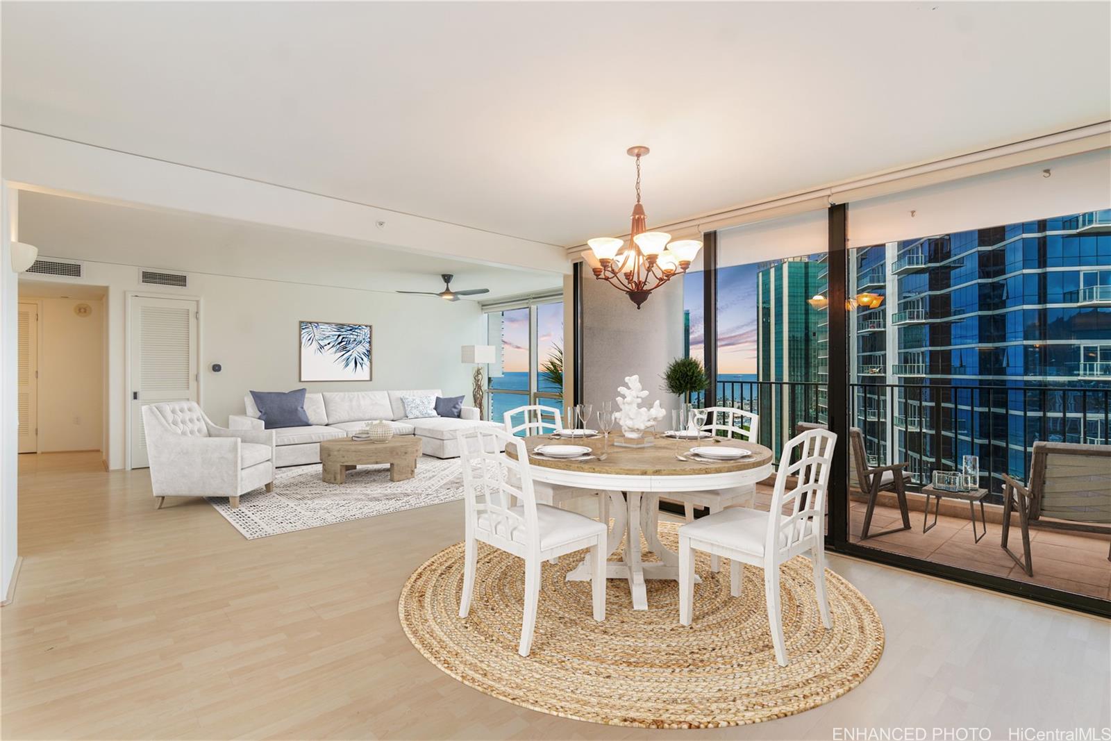 a view of a dining room with furniture wooden floor and chandelier