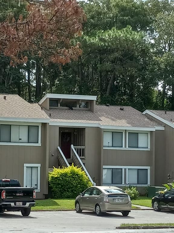 a car parked in front of a house