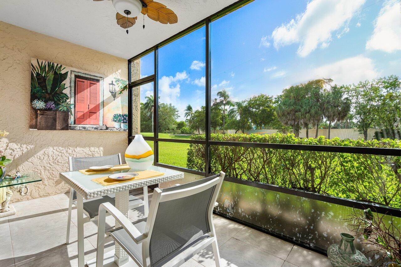 a view of balcony with furniture and garden