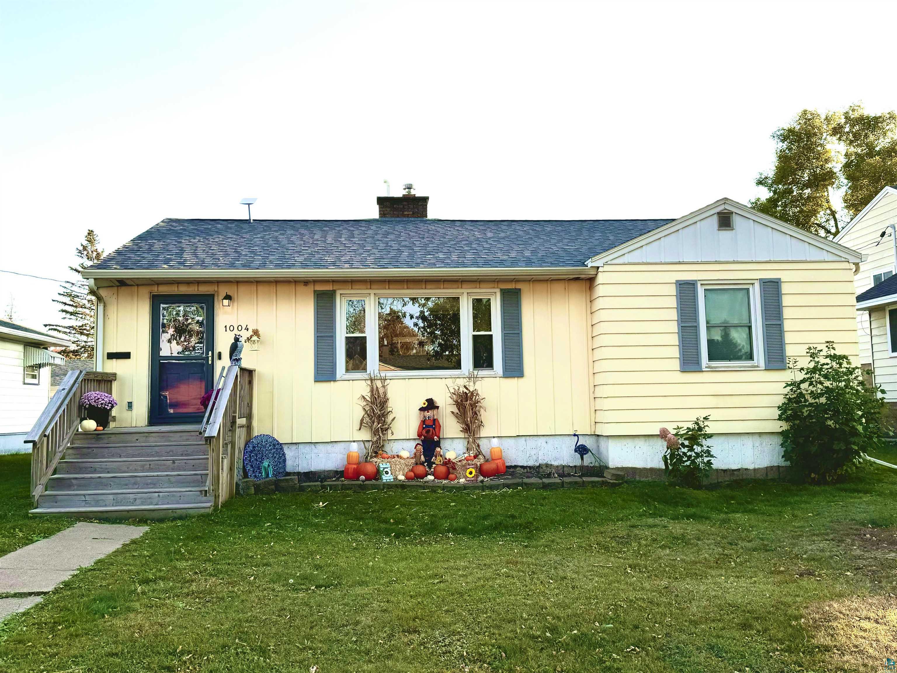 View of front of property with a front lawn